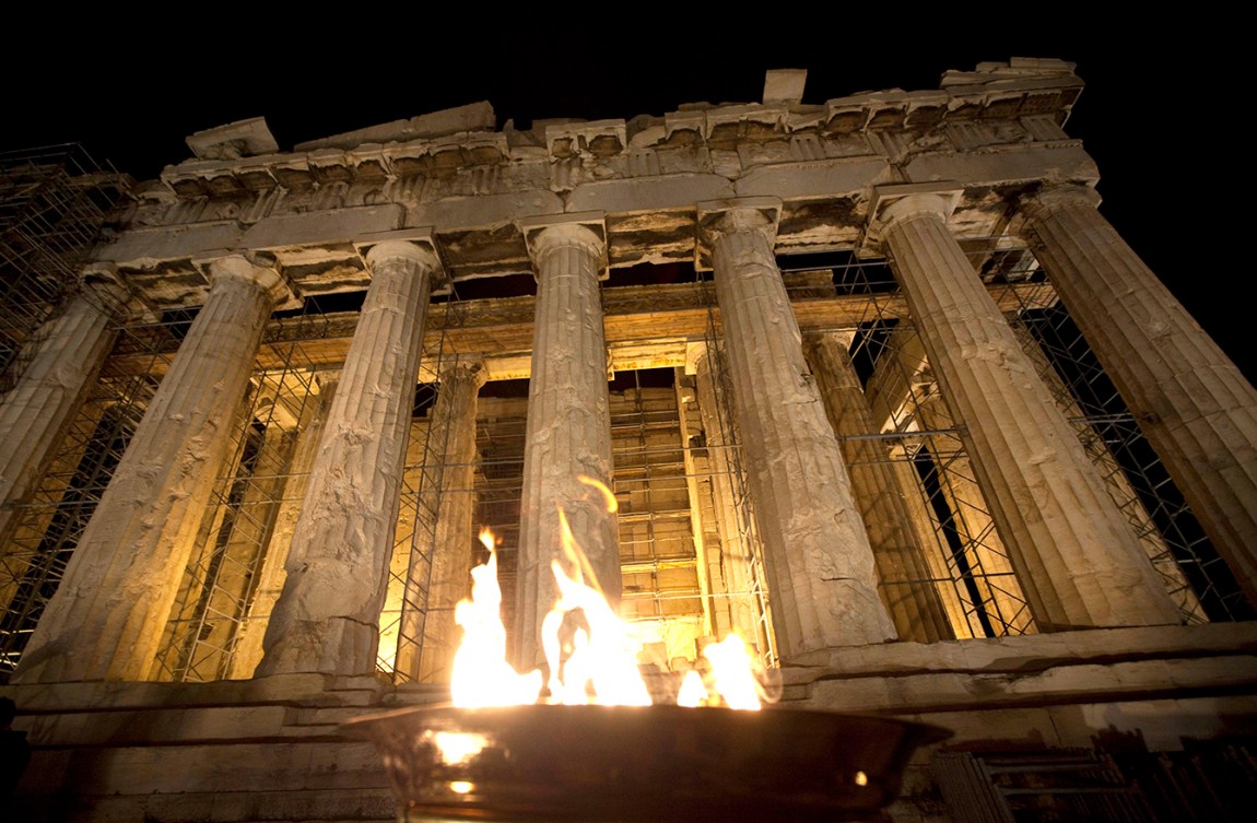 The Olympic Flame burns in a caldron outside the Parthenon on top of the Acropolis in Athens, Greece. Photo: The Canadian Press