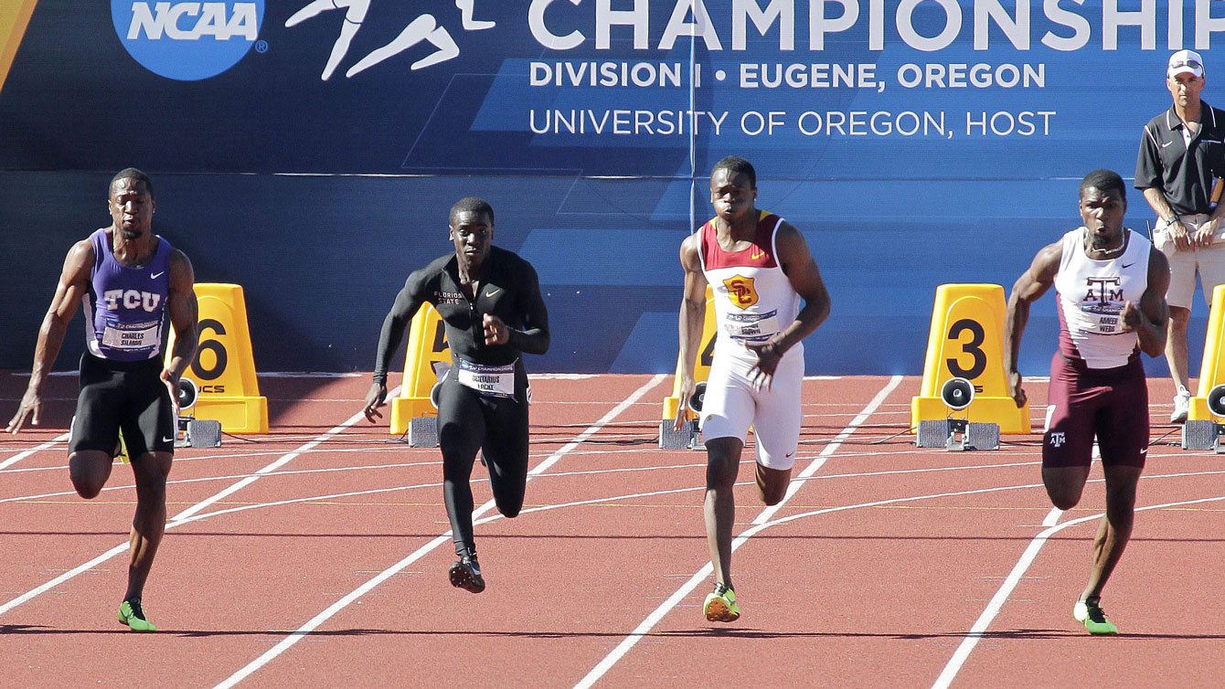 Aaron Brown (second from right) at the NCAA Track and Field Championships in 2013) via The Canadian Press.