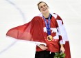 Marie-Philip Poulin célèbre la médaille d'or en hockey sur glace d'Équipe Canada aux Jeux olympiques de Sochi 2014.