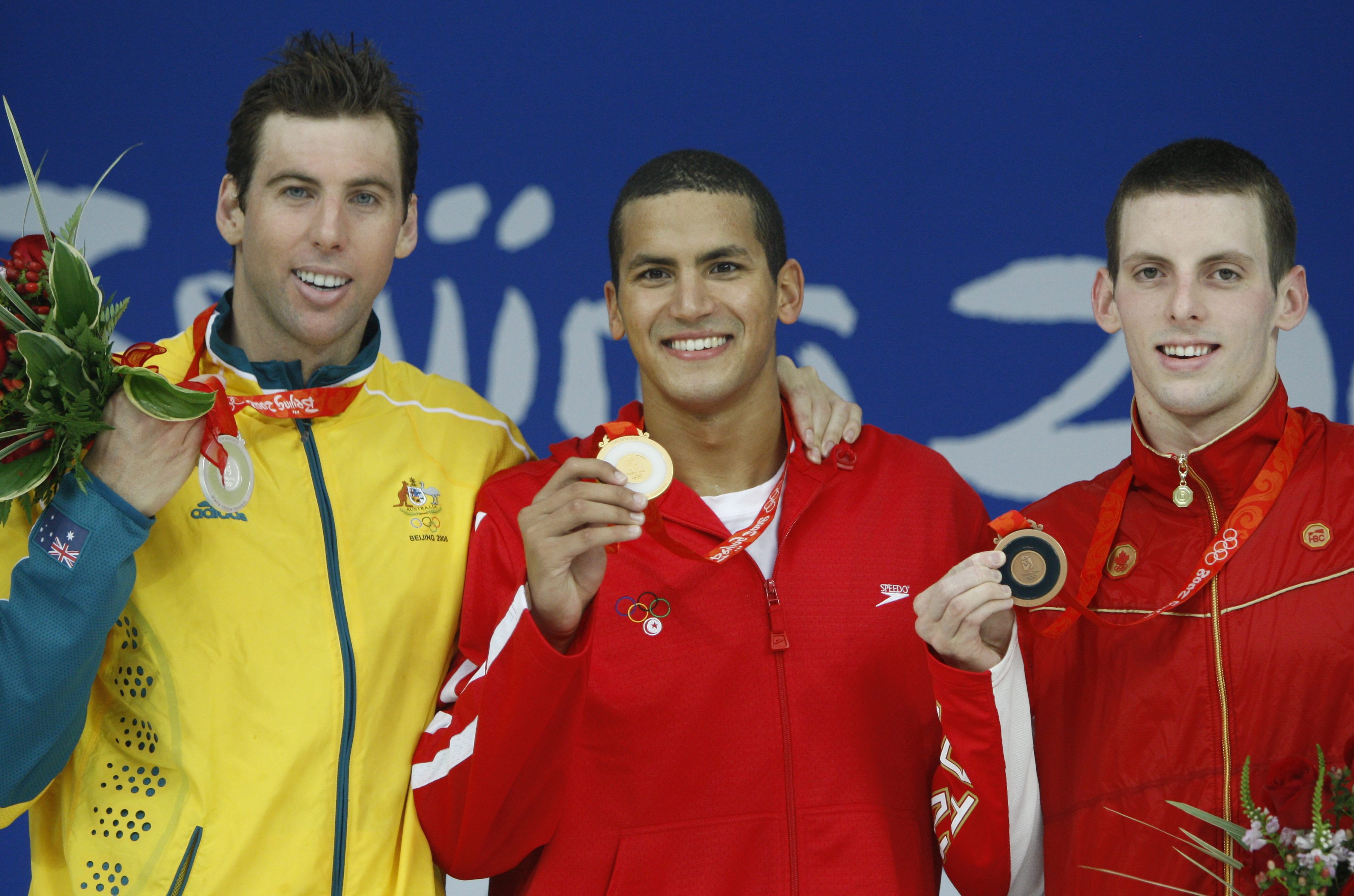Les médaillés : L'Australien Grant Hackett (argent), le Tunisien Oussama Mellouli (or) et le Canadien Ryan Cochrane (bronze), le 17 août 2008. (AP Photo/Mark Baker)