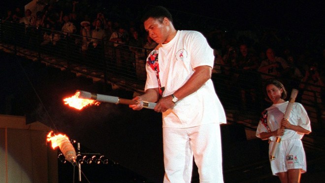 Muhammad Ali lights the Olympic flame in Atlanta on July 19, 2016.  Muhammad Ali lights the Olympic flame in Atlanta on July 19, 2016.
