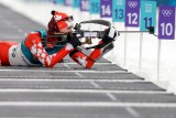 Nathan Smith tire lors du sprint de 10 km en biathlon aux Jeux olympiques d’hiver de PyeongChang. (AP Photo/Andrew Medichini)