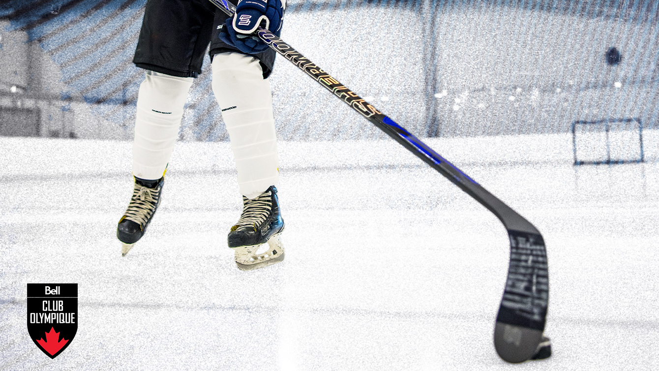 Skating on ice while playing with a hockey stick and puck