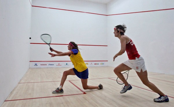 Canada's Samantha Cornett (right) compete in the women's team squash final match at the Pan American Games in Guadalajara, Oct. 21, 2011.