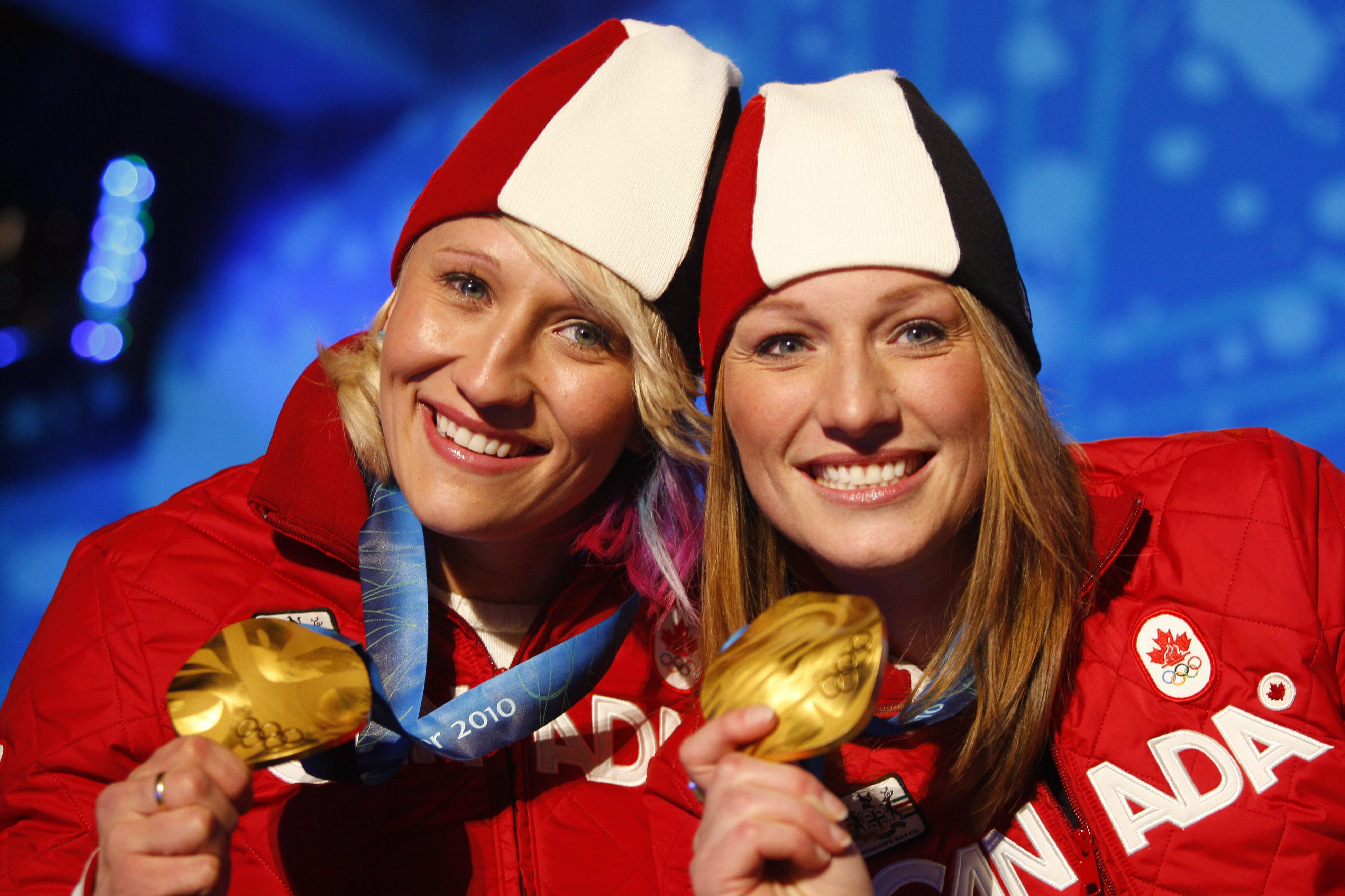 Canadian bobsleigh gold medallists Kaillie Humphries, left, and Heather Moyse pose with their medals at the awards ceremony on Thursday February, 25, 2010 at the Whistler Olympic Park during the 2010 Olympic Winter Games. THE CANADIAN PRESS/Jeff McIntosh