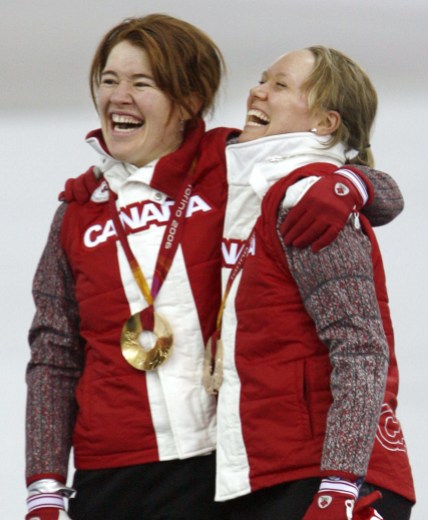 Hughes Klassen Clara Hughes and Cindy Klassen sing O Canada together after winning gold and bronze in the 5000m at Turin 2006.