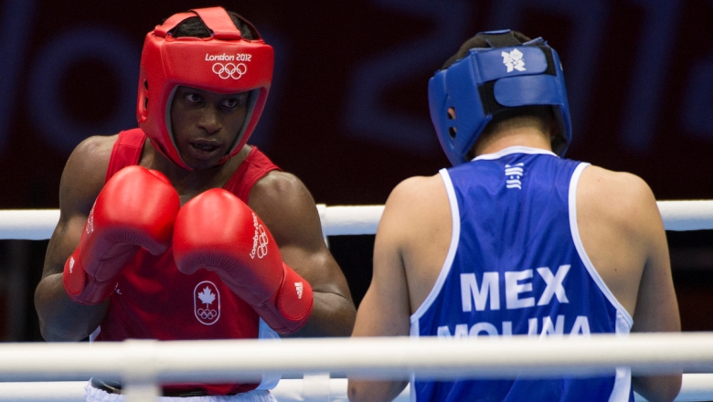 Custio Clayton (left) was Canada's latest Olympic medal hope, however a controversial decision against a British fighter at London 2012 saw him lose a quarterfinal decision.