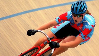 Tanya Dubnicoff races in a track cycling event.