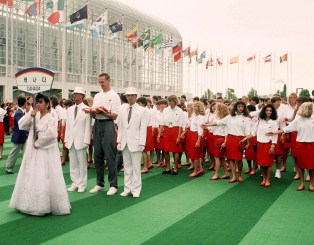 Canadian athletes gather to watch a flag raising