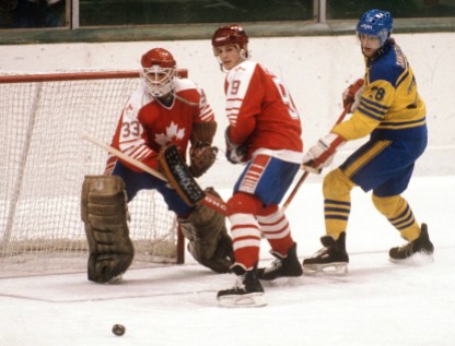 James Patrick (#9) and Mario Gosselin (goalie) Canada's James Patrick (#9) and Mario Gosselin (goalie) look towards the puck during hockey action against Sweden at the 1984 Winter Olympics in Sarajevo. (CP PHOTO/ COC/O. Bierwagon ) James Patrick (9) et Mario Gosselin (gardien) du Canada regardent la rondelle lors d'un match de hockey contre la Suède aux Jeux olympiques d'hiver de Sarajevo de 1984. (Photo PC/AOC)