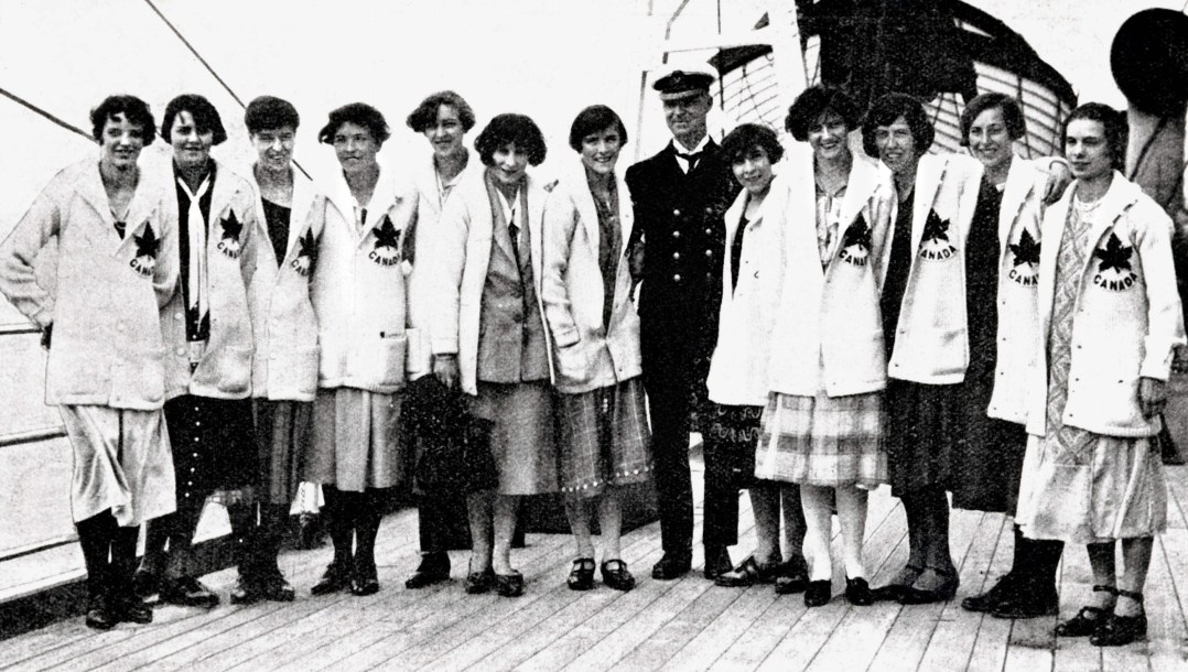 Canadian women stand in uniform on a boat
