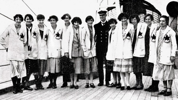 Women's athletics team Canadian women stand in uniform on a boat