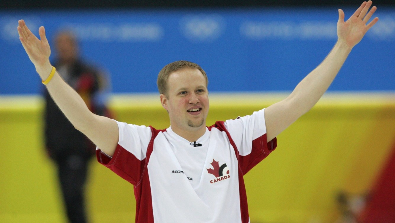 Mark Nichols raises his arms in celebration