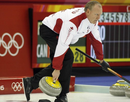 Canada's Russ Howard delivers a rock on route to winning the gold medal by defeating Finland 10-4 at the Pinerolo Palaghiaccio at the Turin 2006 Olympic Winter Games Friday, Feb. 24, 2006 in Pinerolo, Italy.(CP PHOTO/Andrew Vaughan)