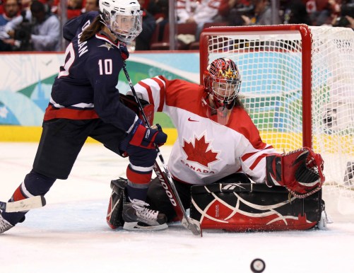 Meghan Duggan , Shannon Szabados USA's Meghan Duggan and Canada's goaltender Shannon Szabados keep their eyes on the puck during second period women's gold medal Olympic hockey action at the 2010 Winter Olympic Games in Vancouver, Thursday, Feb. 25, 2010. THE CANADIAN PRESS/Jonathan Hayward