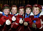 Canadian Women's Curling team (left to right) Cheryl Noble, of Victoria, Kelley Law, of Coquitlam, B.C., Diane Nelson, of Burnaby, B.C., Julie Skinner, of Victoria, and Georgina Wheatcroft, of Victoria, show off their bronze medals Thursday Feb. 21, 2002, at the 2002 Olympic Winter Games in Salt Lake City. They beat Team USA to bring home the bronze. (CP Photo/COC/Andre Forget)