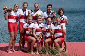 The women's eights team poses with their medals