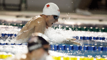 Baumann swimming during a race