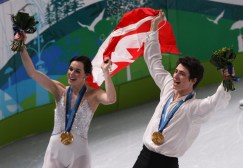 Tessa Virtue of London, Ont. and Scott Moir of Ilderton, Ont. do a victory lap with their gold medals in ice dance at the Pacific Coliseum at the Olympic Winter Games in Vancouver, B.C, Monday, Feb. 22, 2010. (CP PHOTO)2010(HO-COC-Mike Ridewood)