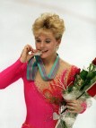 Elizabeth Manley bites the silver medal she won at Calgary 1988.