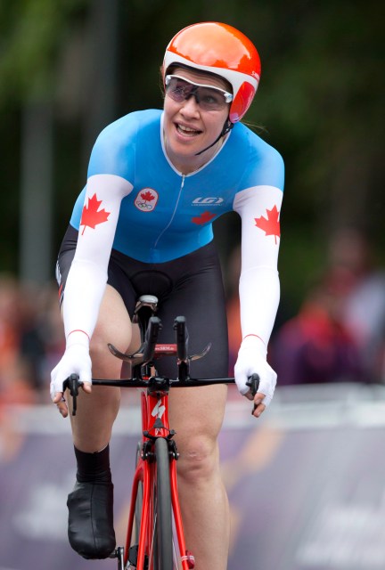 Clara Hughes Clara Hughes smiling on bike