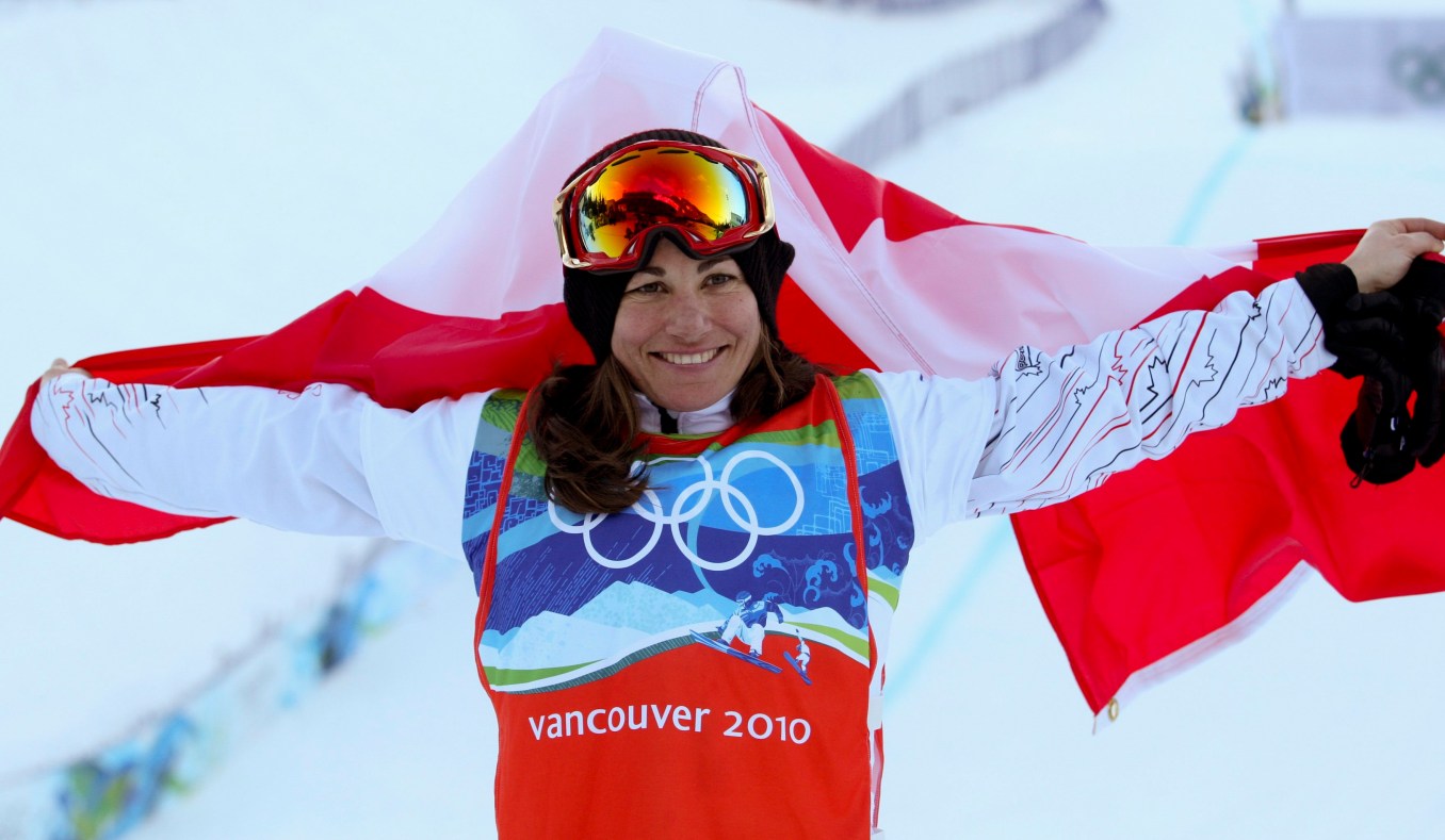 Maelle Ricker of West Vancouver celebrates her gold medal win in women's snowboard cross at Cypress Mountain at the Winter Olympics in Vancouver, B.C, Tuesday, Feb. 16, 2010. (CP PHOTO)2010(HO-COC-Mike Ridewood)