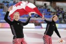 Gold medallist Canada's Cindy Klassen, left, and silver medalist, teammate Kristina Groves, skate around the oval with the Canadian flag following the womens 1,500 metre speedskating competition at the Turin 2006 Winter Olympic Games Wednesday, Feb. 22, 2006 in Turin. (CP PHOTO/Paul Chiasson)