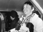 Nancy Greene wears her medals in the back of a car