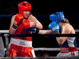 Boxer, Mary Spencer in the ring taking a punch