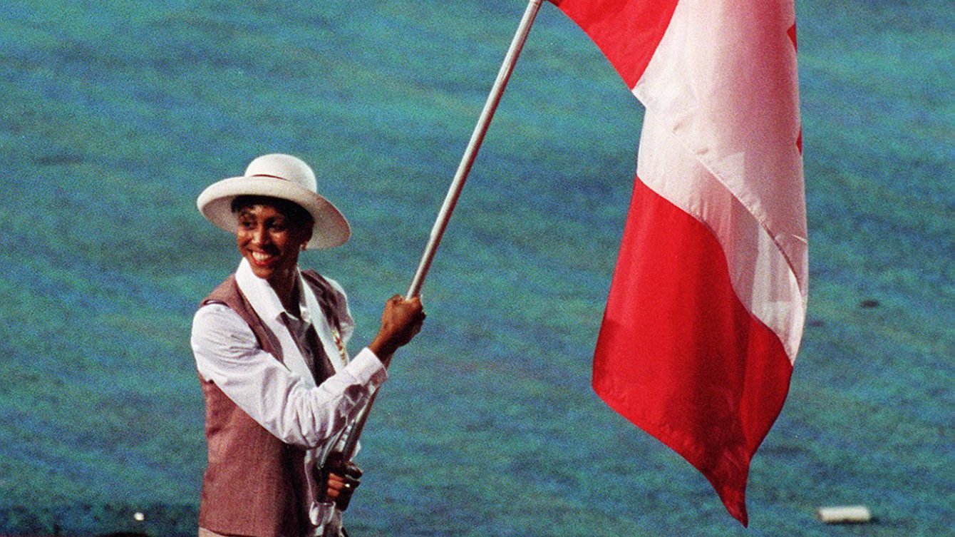 Charmaine Crooks carries Canadian flag in opening ceremony
