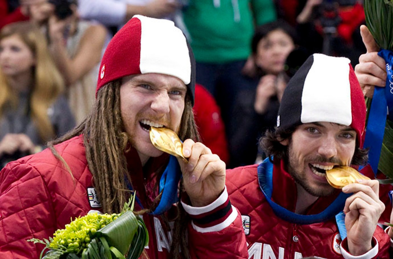 Charles Hamelin Francois Hamelin Olivier Jean Francois-Louis Tremblay Guillaume Bastille Olivier Jean and Charles Hamelin bite their 5000m relay gold medals at Vancouver 2010 THE CANADIAN PRESS/Paul Chiasson
