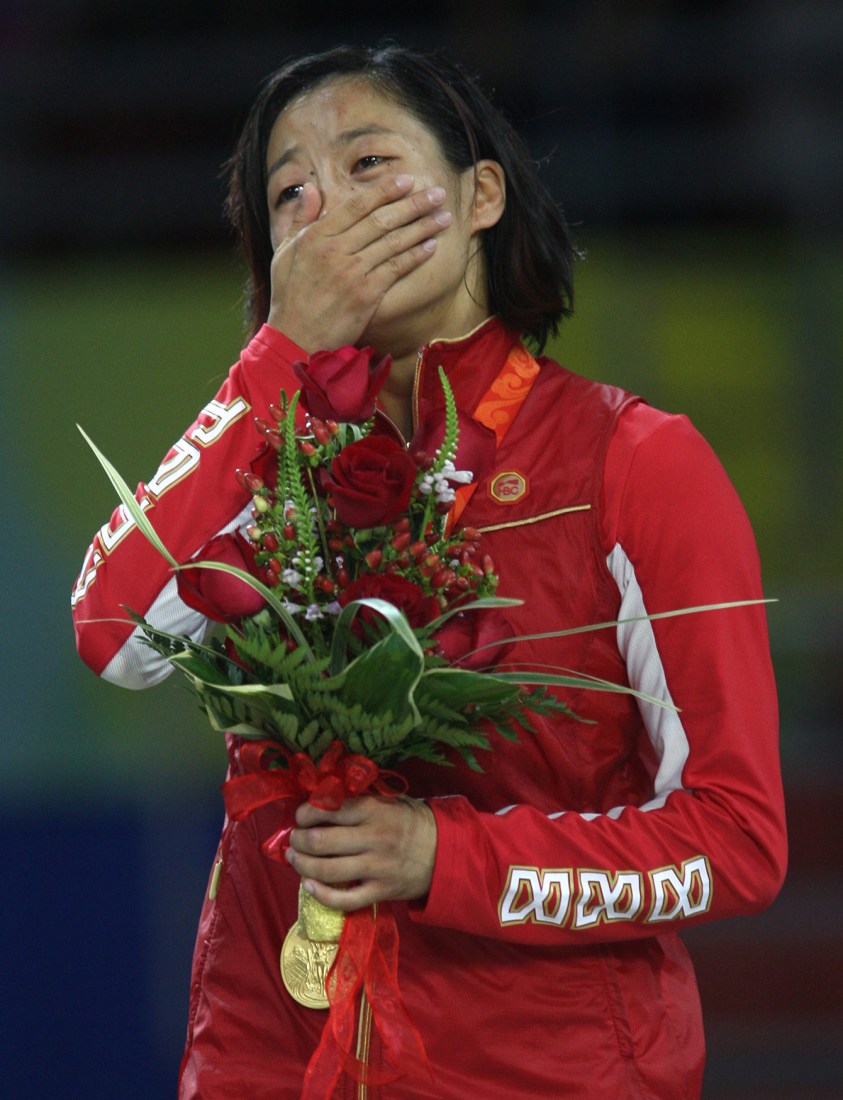 Carol Huynh Crying listening to national anthem on podium