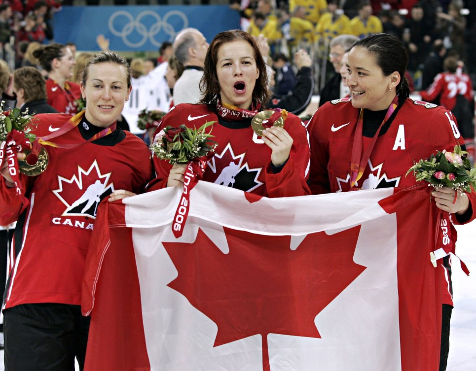 Jayna Hefford, Cassie Campbell, and Vicky Sunohara celebrate gold medal at Turin 2006