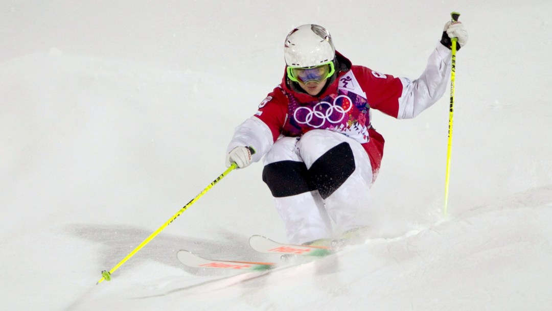 Maxime Dufour-Lapointe skis down a moguls course