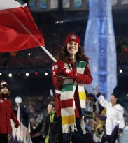 Hughes carrying Canadian flag in Opening Ceremony