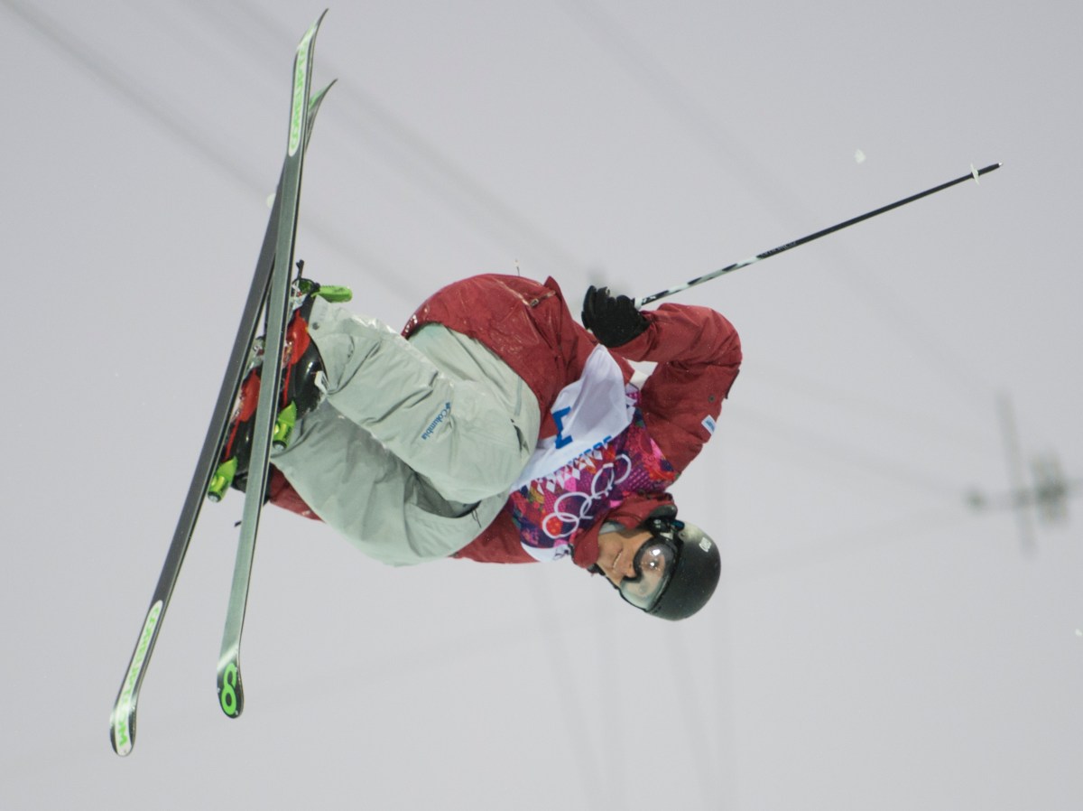 An athlete competing in ski halfpipe
