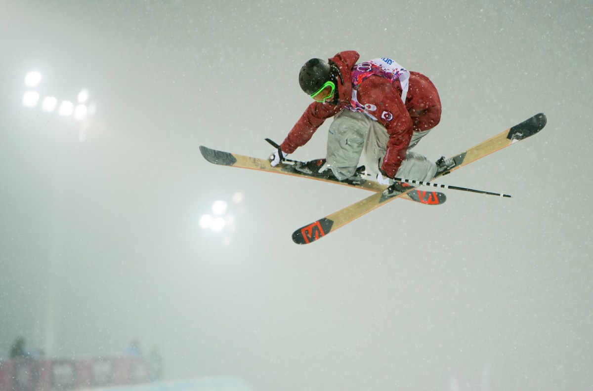 An athlete competing in ski halfpipe