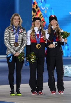 Justine Dufour-Lapointe receives her gold medal and her sister Chloe a silver