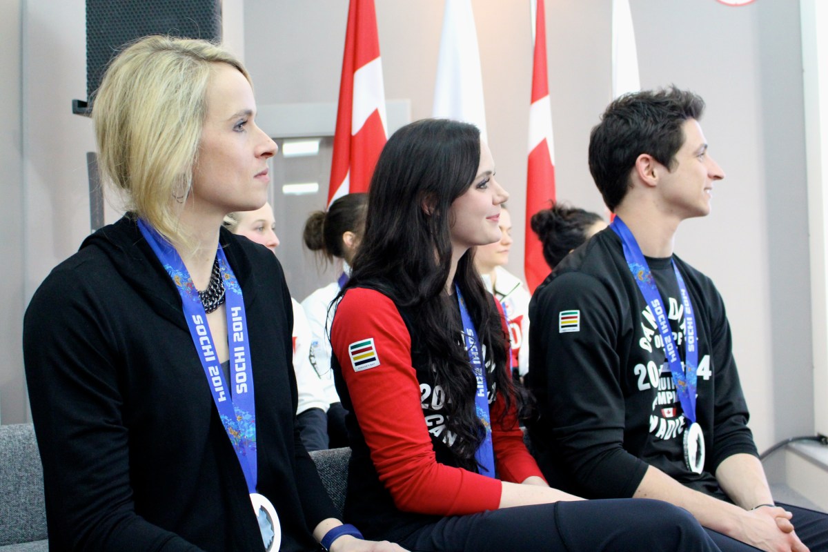 Dominique Maltais, Tessa Virtue and Scott Moir during the medal celebration