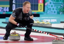 Brad Jacobs of Canada yells to his sweepers playing against Great Britain in the men's gold medal curling final at the Sochi Winter Olympics in Sochi, Russia, Firday, Feb. 21, 2014. THE CANADIAN PRESS/HO, COC - Mike Ridewood