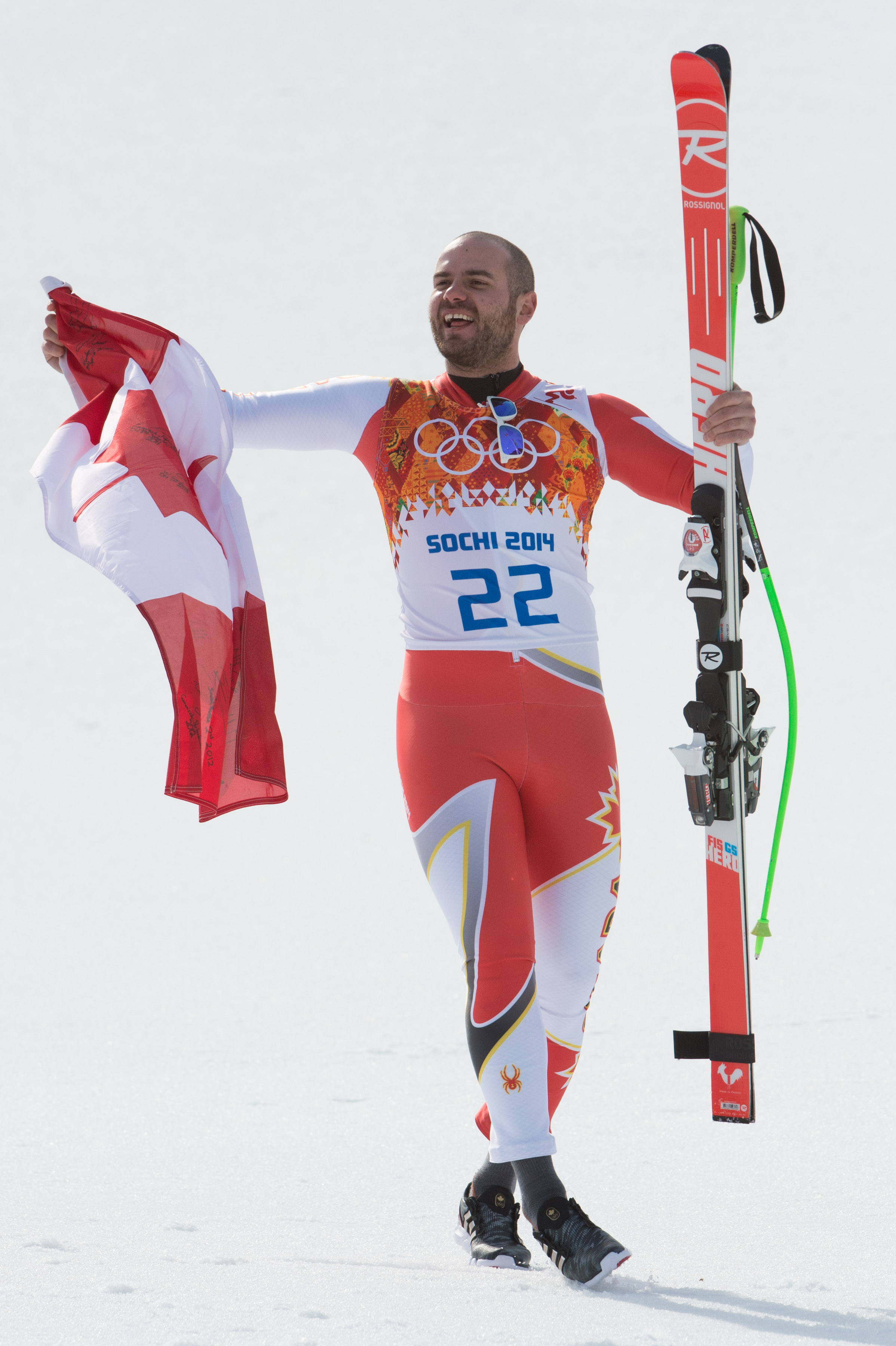 Jan Hudec waves a Canadian flag after finishing third in men's super-G at the Sochi Winter Olympics in Krasnaya Polyana, Russia, Sunday, Feb. 16, 2014. THE CANADIAN PRESS/HO, COC - Winston Chow