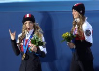 Justine Dufour-Lapointe receives her gold medal and her sister Chloe a silver