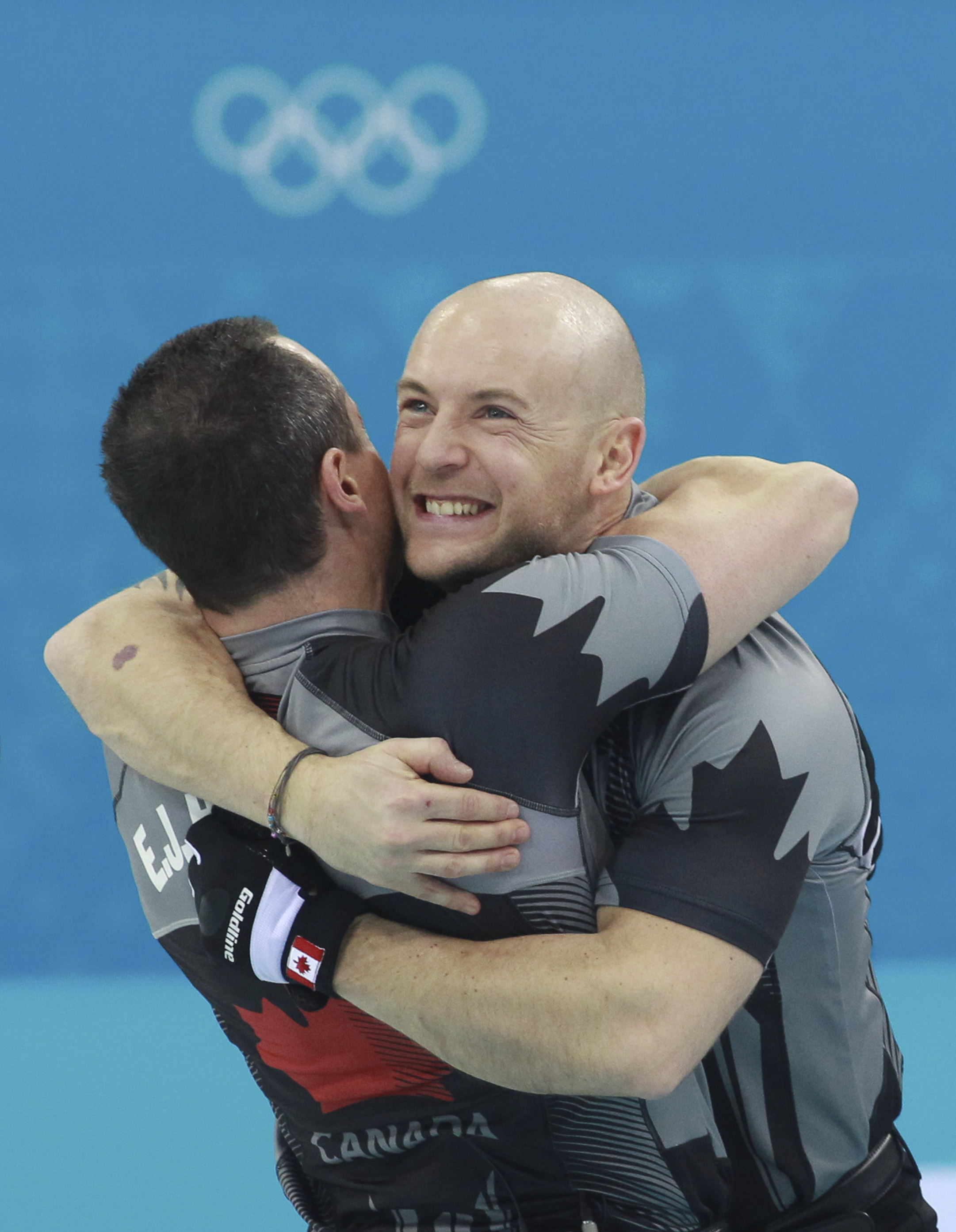 Two Team Canada teammates hugging