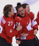 Team Canada celebrates beating Team USA in the gold medal women's hockey match