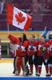 Team Canada celebrates beating Team USA in the gold medal women's hockey match
