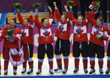 Team Canada celebrates beating Team USA in the gold medal women's hockey match