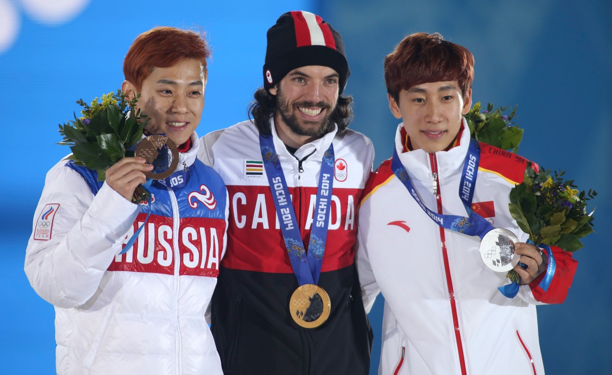 Charles Hamelin receives his gold medal in men's 1500 metre short track