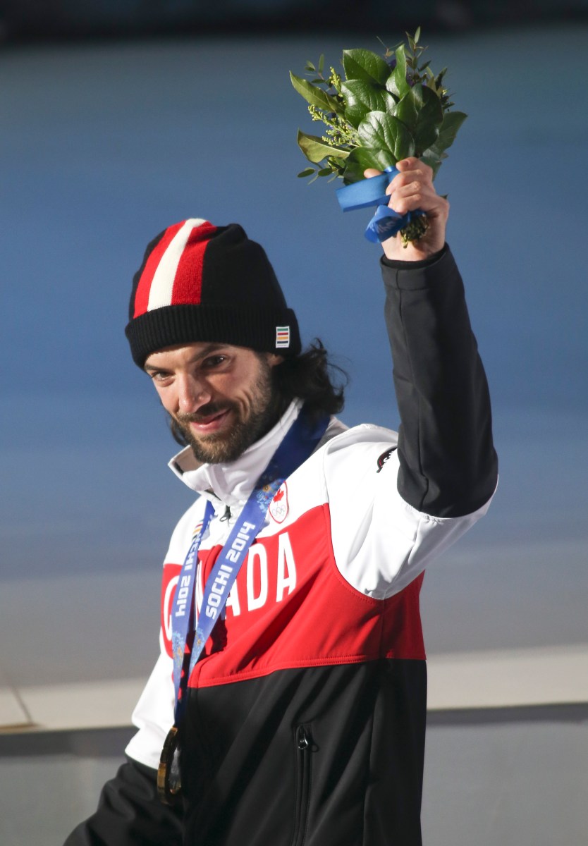 Charles Hamelin receives his gold medal in men's 1500 metre short track