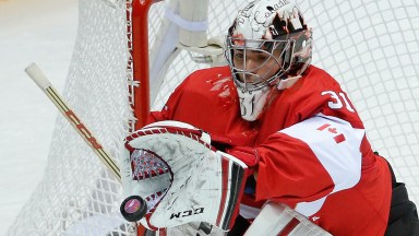 Canada goaltender Carey Price stops a shot on goal by Norway in the first period of a men's ice hockey game at the 2014 Winter Olympics, Thursday, Feb. 13, 2014, in Sochi, Russia. (AP Photo/Mark Humphrey)