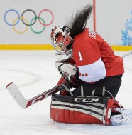Goalkeeper Shannon Szabados of Canada stops at shot on the goal during the game against Finland at 2014 Winter Olympics women's ice hockey match at Shayba Arena, Monday, Feb. 10, 2014, in Sochi, Russia. (AP Photo/Matt Slocum)